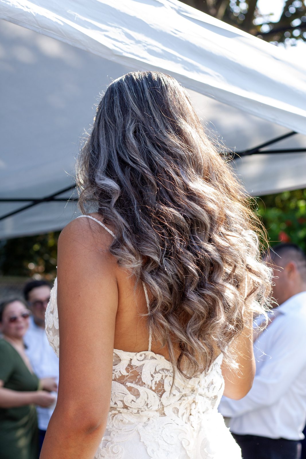 Bride in her gown at an outdoor celebration